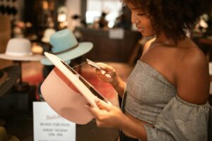 Woman shopping and looking at price tage